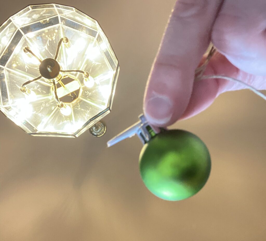 Adding Christmas ornaments to farmhouse beads